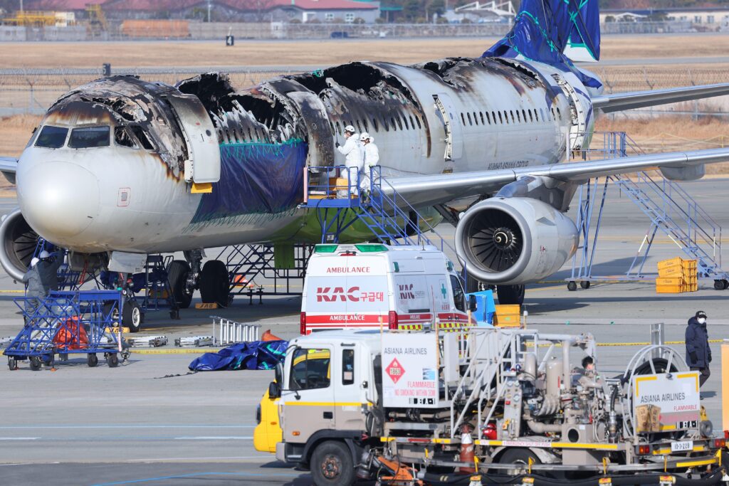 a large airplane with a burned out body
